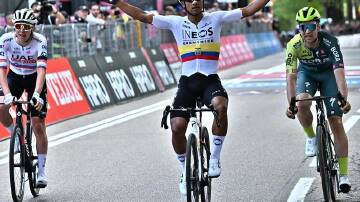 Jhonatan Narvaez celebrates after crossing the finish line to win the first stage of the Giro. (EPA PHOTO)